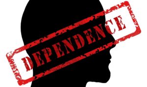 Silhouette of man with the word "Dependency" over it